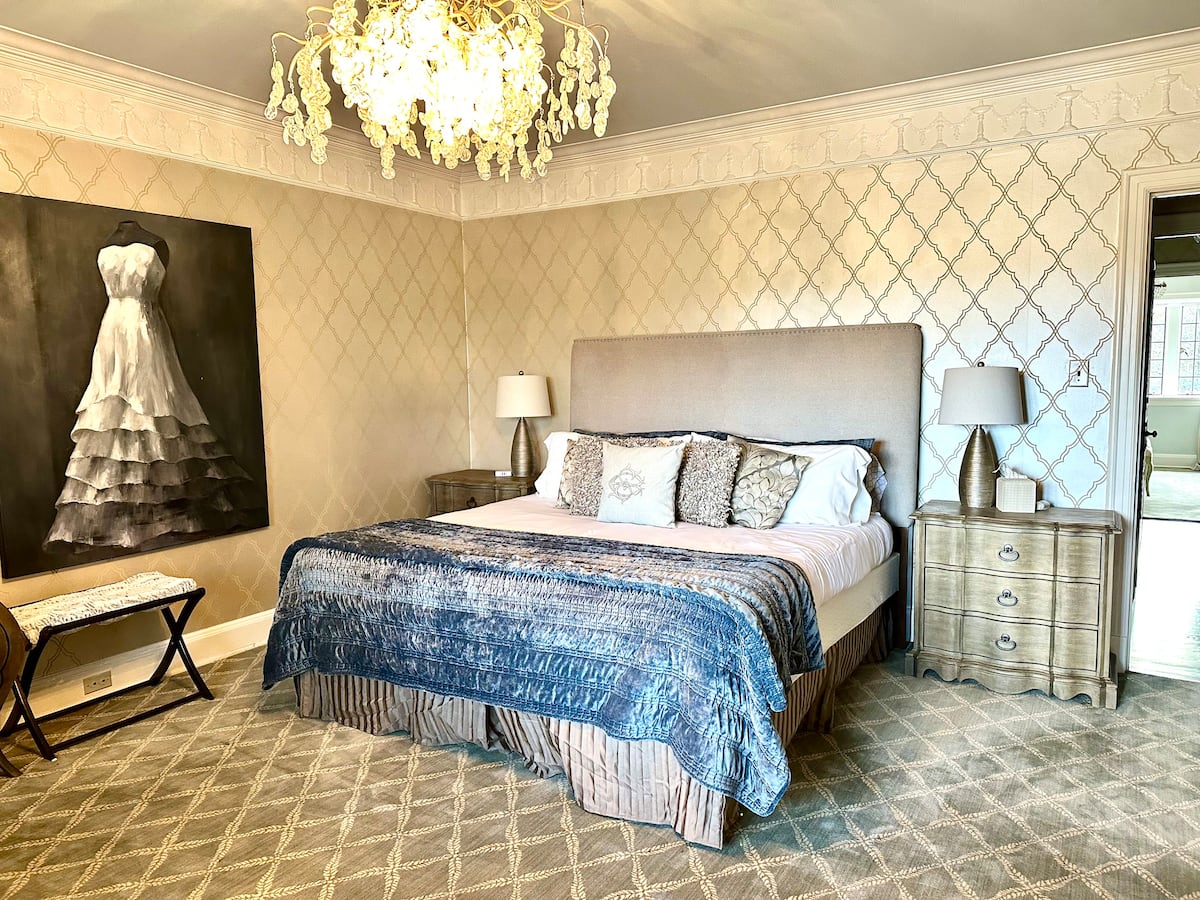 Luxury master bathroom with dual vanity and gold fixtures