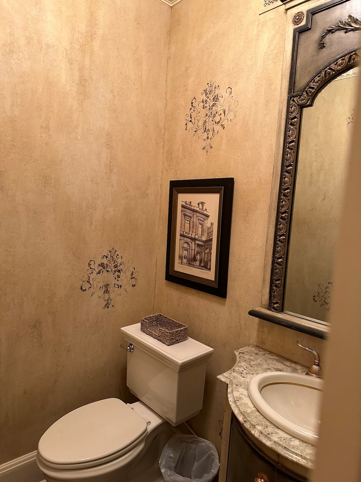 Decorative powder room with framed artwork