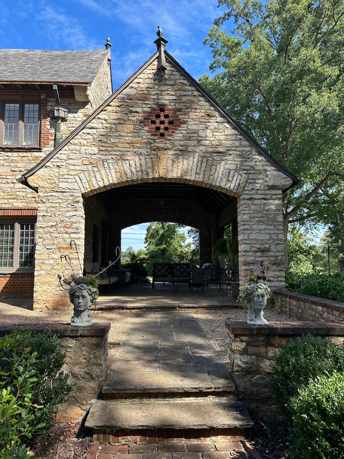 Stone porte-cochère entrance with gothic arch